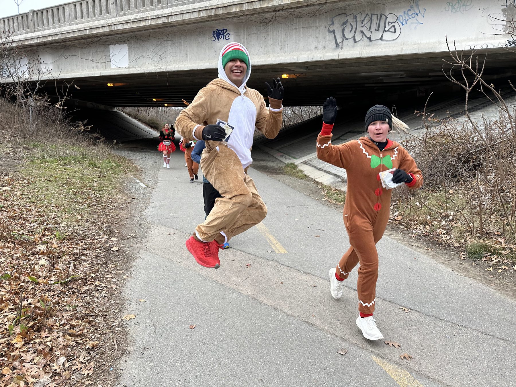Reindeer and gingerbread runners on the bike path with gift cards in hand