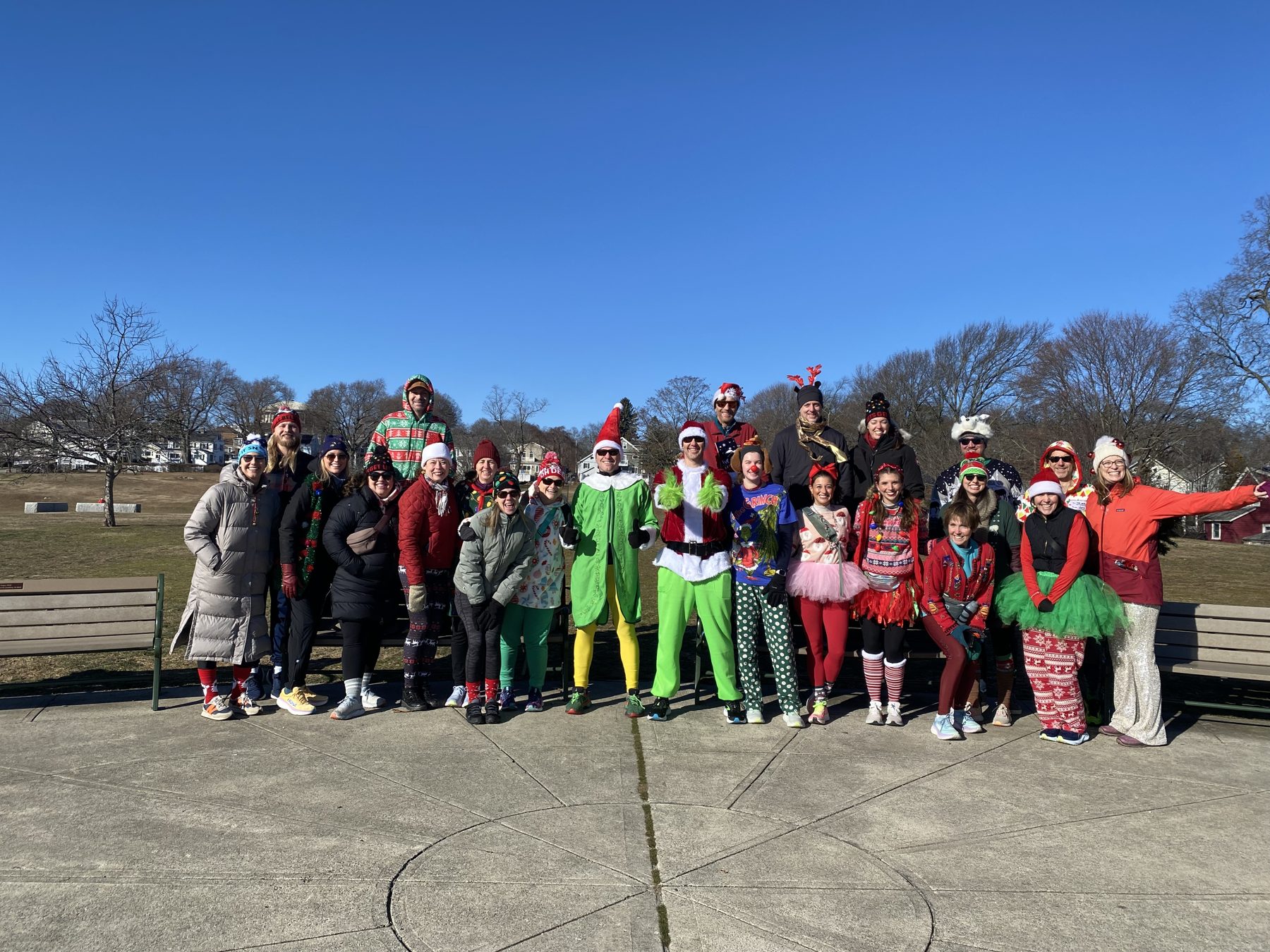 The whole Giving Gallop crew lined up at Robbins Farm Park under a blue sky